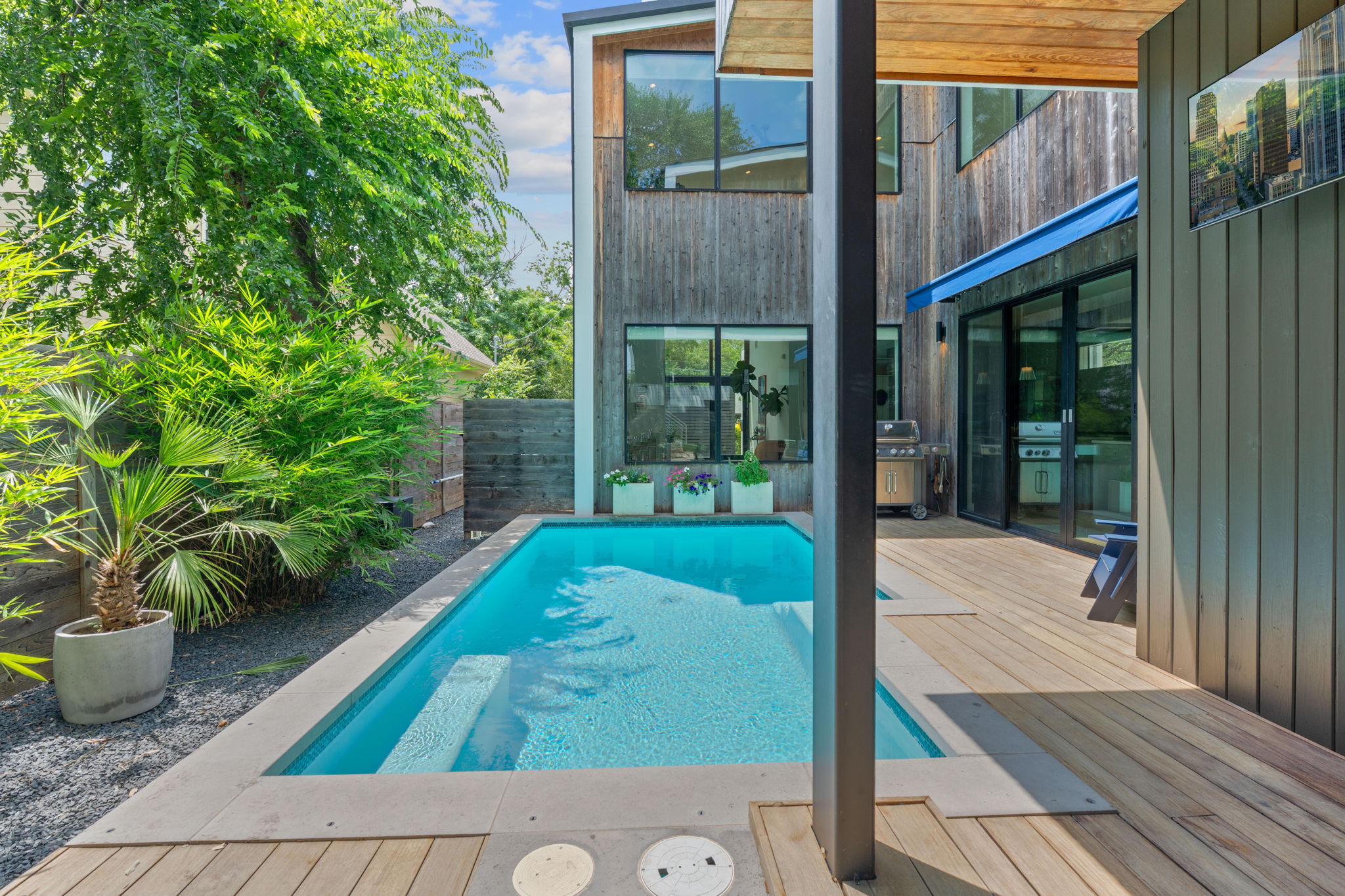 1605 Chelsea Lane, Unit 1 Austin, TX 78704 - Photo 30 of 38 View of swimming pool featuring a deck, area for grilling, and a fenced backyard