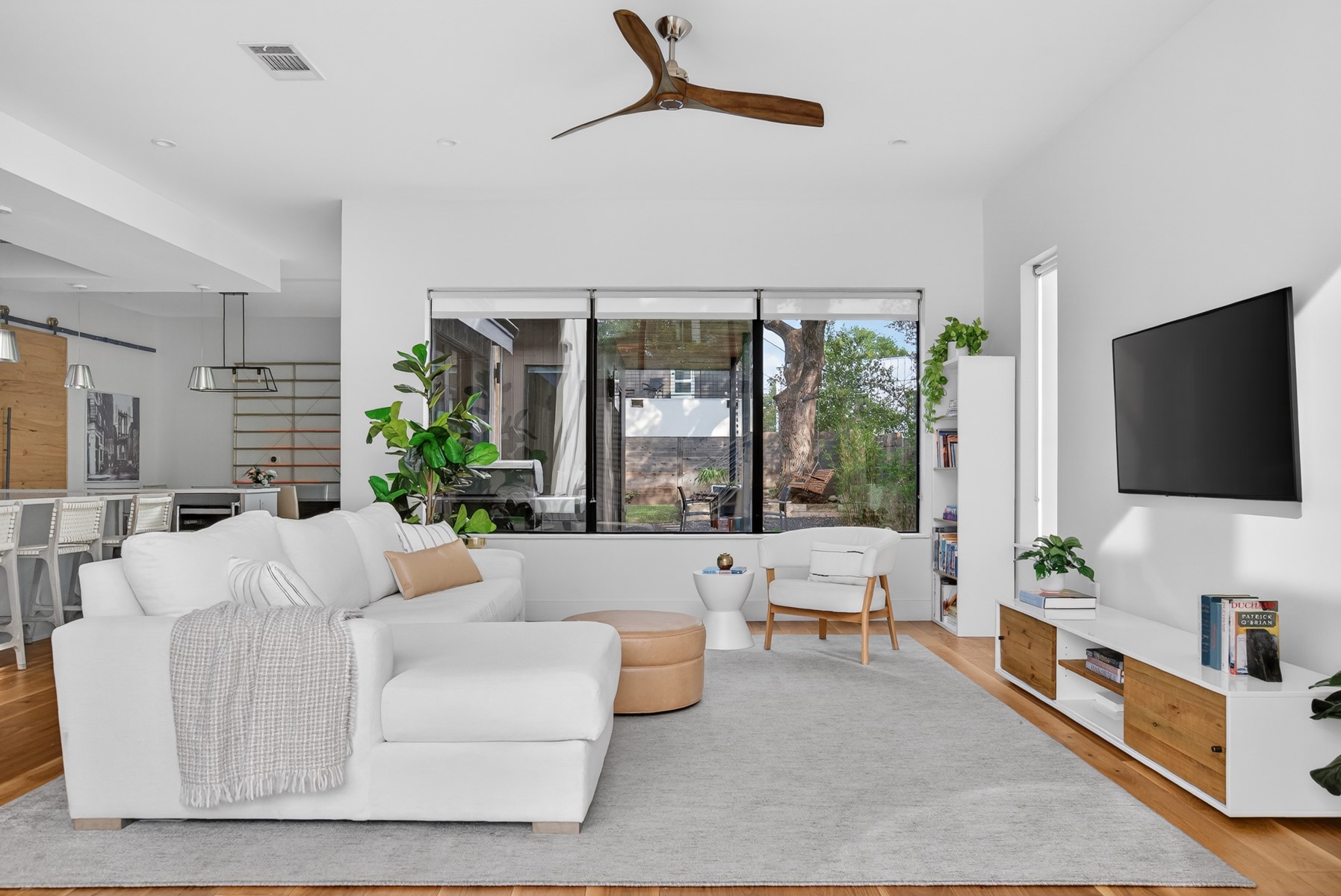 1605 Chelsea Lane, Unit 1 Austin, TX 78704 - Photo 5 of 39 a living room with furniture tv and a large window