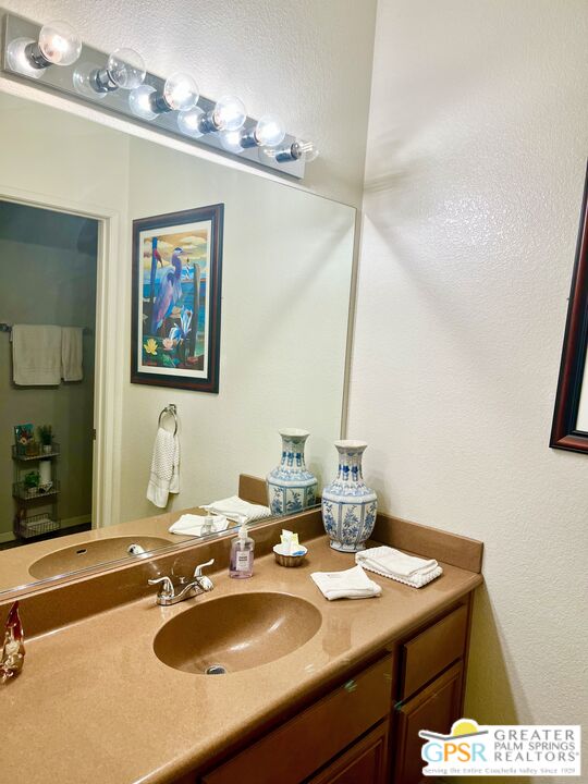 83680 Jaderock Road Coachella, CA 92236 - Photo 14 of 41 a bathroom with a sink and a mirror