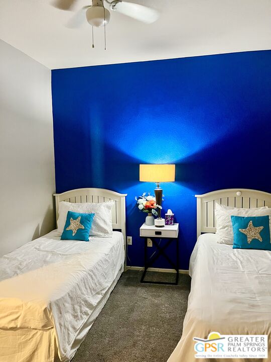 83680 Jaderock Road Coachella, CA 92236 - Photo 18 of 41 a bedroom with a bed and a ceiling fan