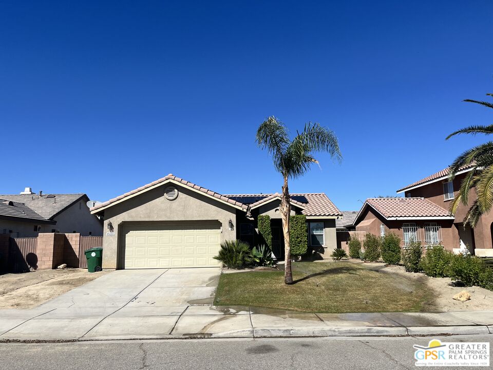 83680 Jaderock Road Coachella, CA 92236 - Photo 2 of 41 a front view of a house with a yard and garage