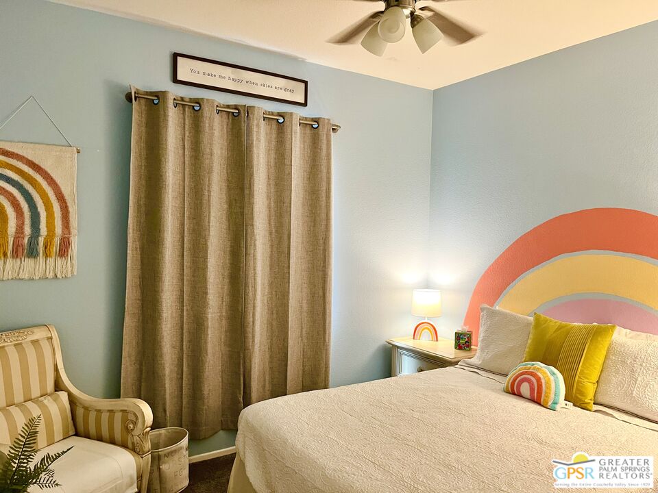 83680 Jaderock Road Coachella, CA 92236 - Photo 22 of 41 a bedroom with a bed and a chandelier