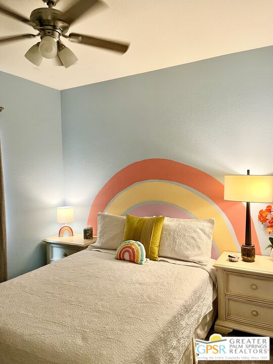 83680 Jaderock Road Coachella, CA 92236 - Photo 23 of 41 a bedroom with a bed and a chandelier