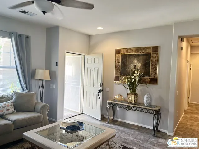 a view of a dining room with furniture and a window