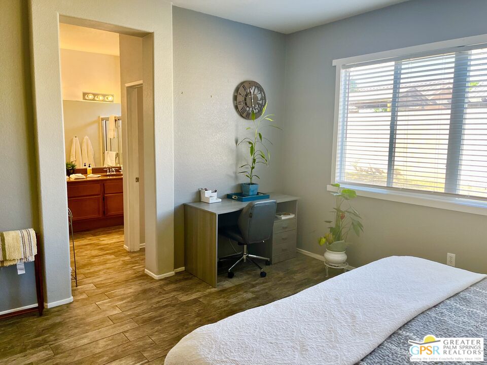 83680 Jaderock Road Coachella, CA 92236 - Photo 31 of 41 a bedroom with a bed and a table in it