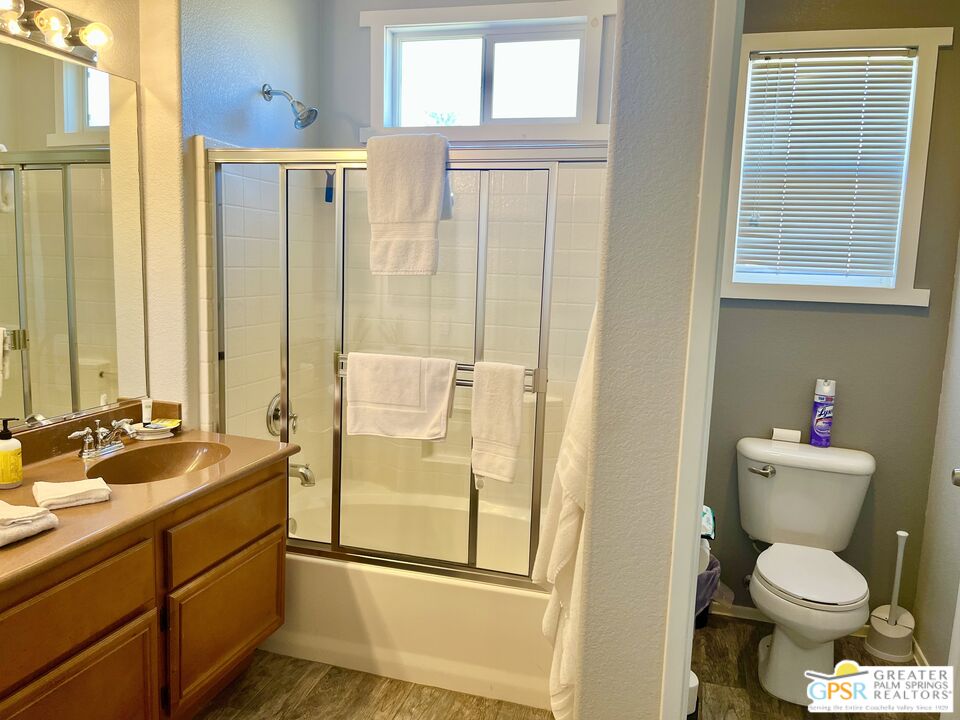 83680 Jaderock Road Coachella, CA 92236 - Photo 36 of 41 a bathroom with a granite countertop toilet sink and a mirror