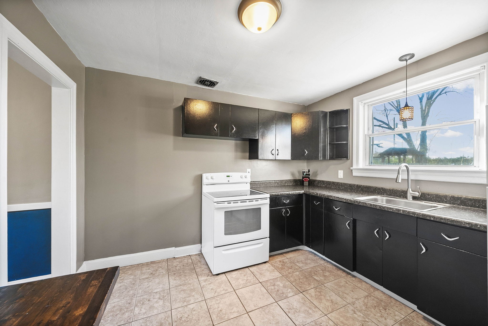 1673 Valley Road Clarksville, TN 37043 - Photo 13 of 33 a kitchen with stainless steel appliances granite countertop a sink and cabinets
