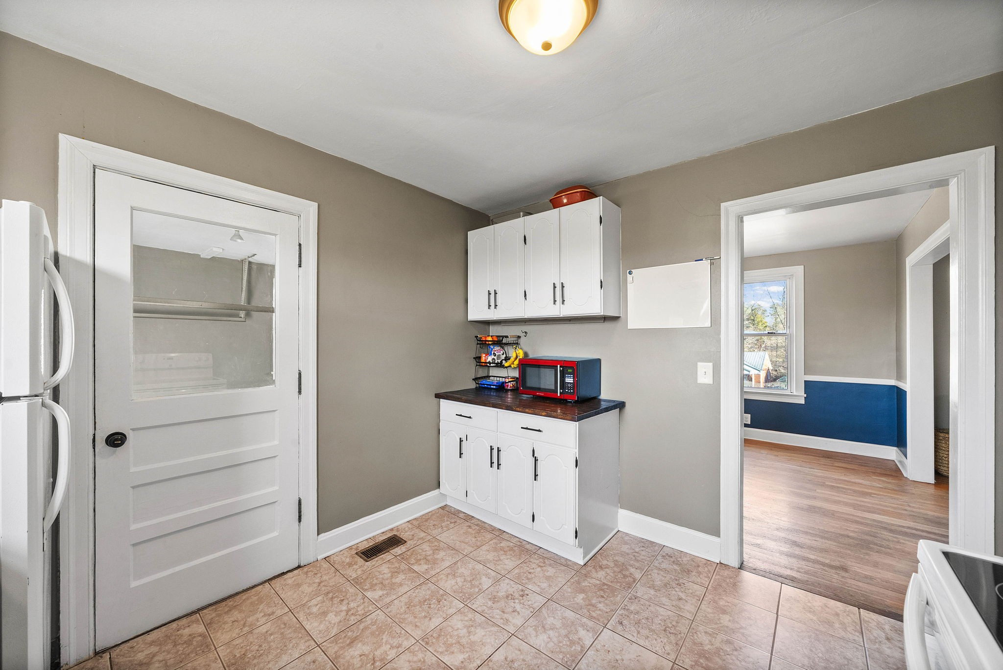 1673 Valley Road Clarksville, TN 37043 - Photo 14 of 33 a kitchen with cabinets and wooden floor