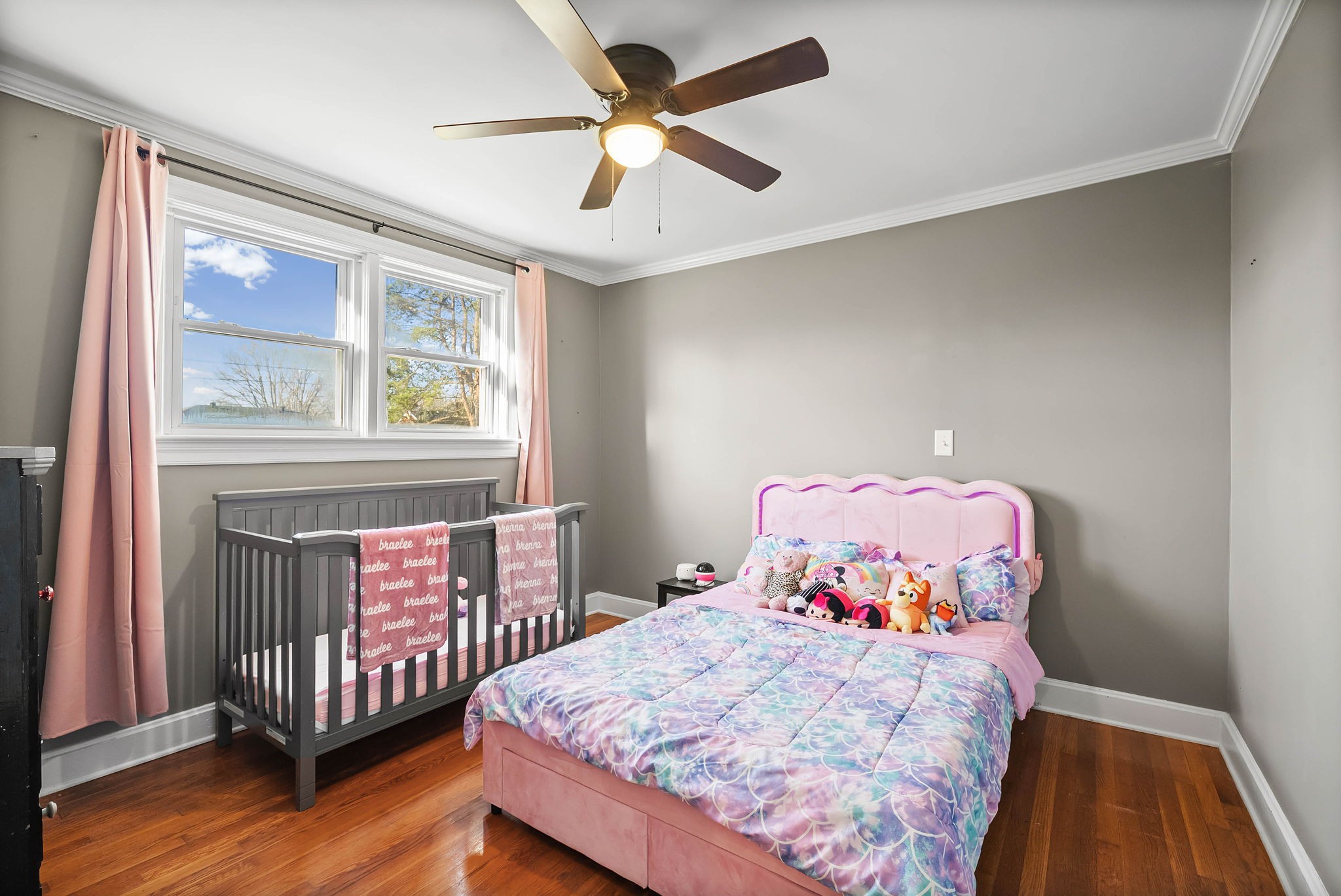 1673 Valley Road Clarksville, TN 37043 - Photo 20 of 33 a bedroom with a bed and wooden floor