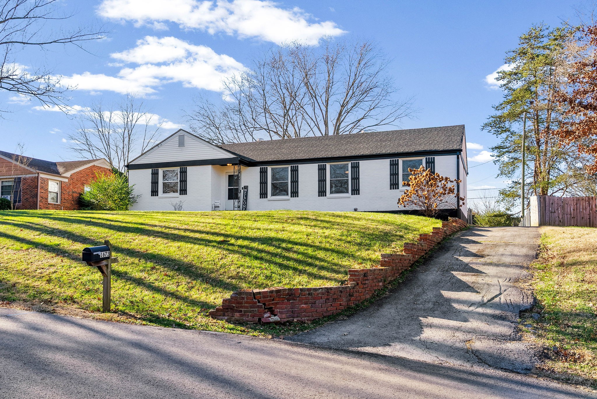 1673 Valley Road Clarksville, TN 37043 - Photo 2 of 33 a view of a house with a big yard and large trees