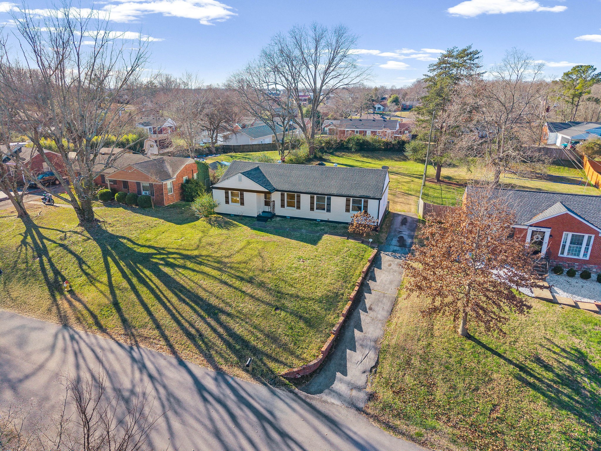 1673 Valley Road Clarksville, TN 37043 - Photo 3 of 33 a view of swimming pool with outdoor seating and trees in the background
