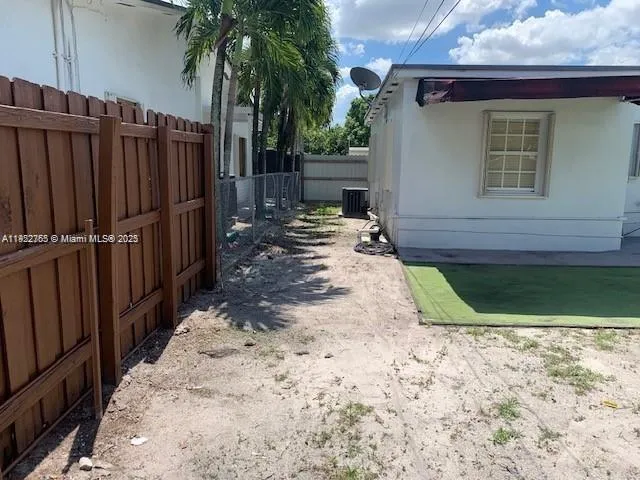a view of a backyard of the house