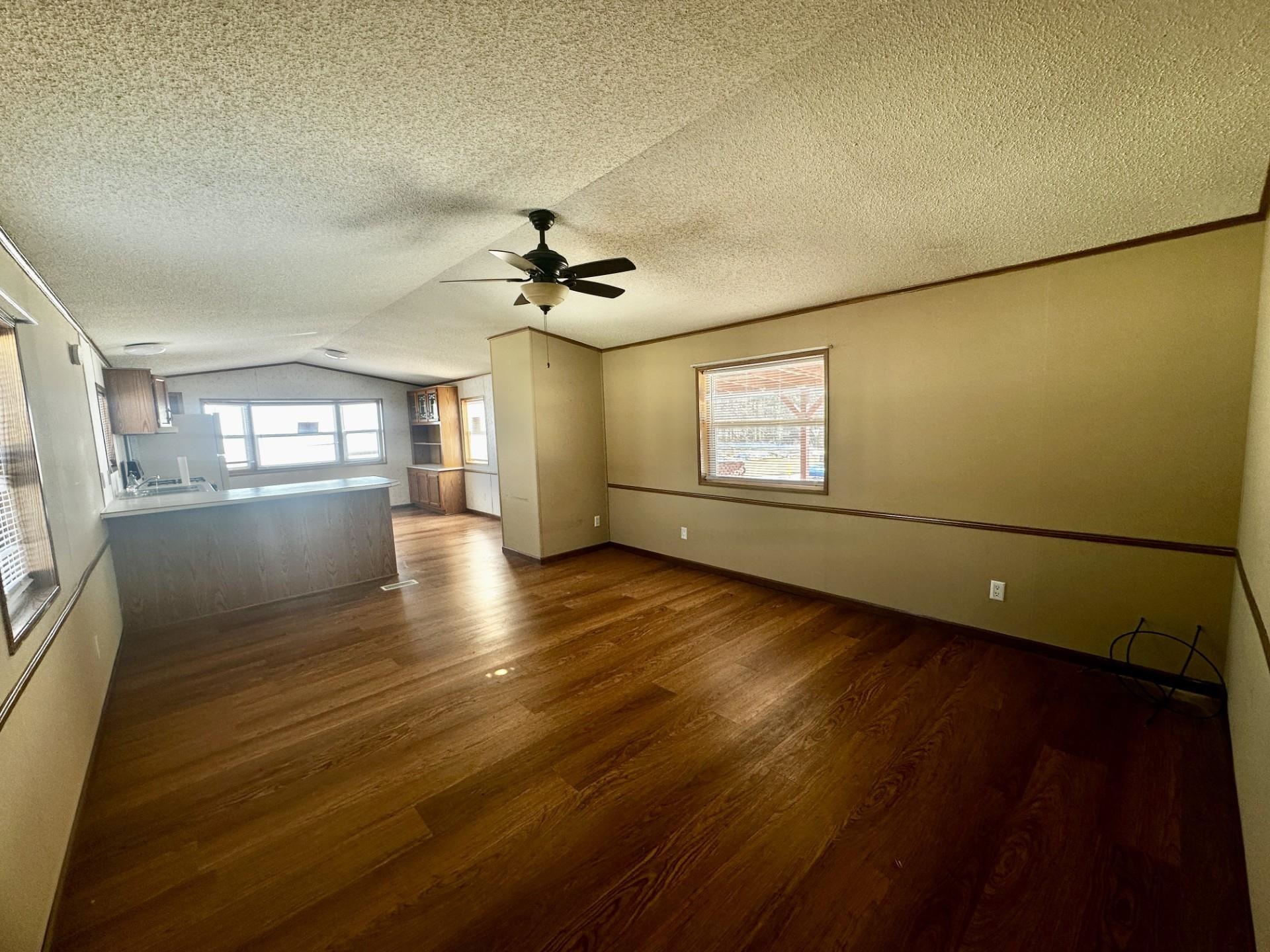 14 Manor Circle Mount Carroll, IL 61053 - Photo 5 of 29 a view of an empty room with window and wooden floor