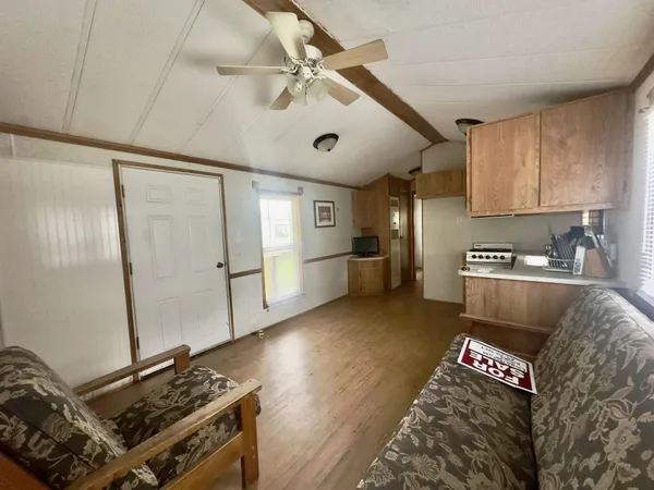 a kitchen that has a sink and a stove in it