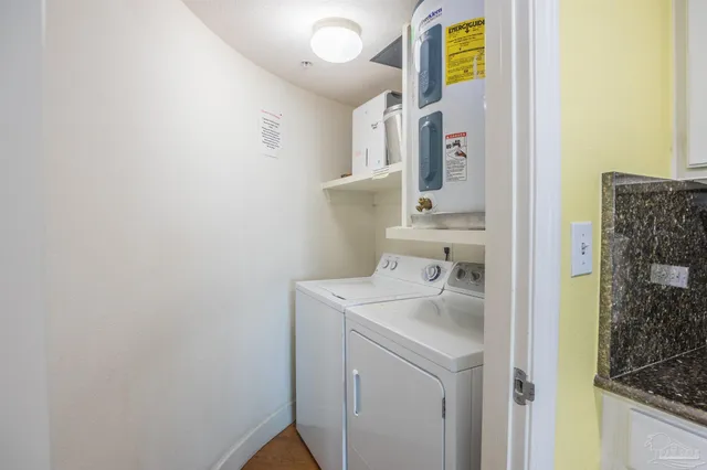 a bedroom with a bed and a flat tv screen