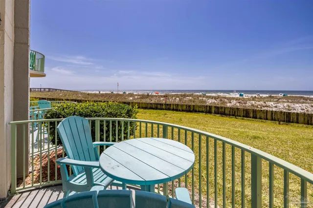 a view of a chair and table on the balcony