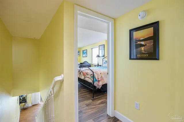 a bed sitting in a room next to a window