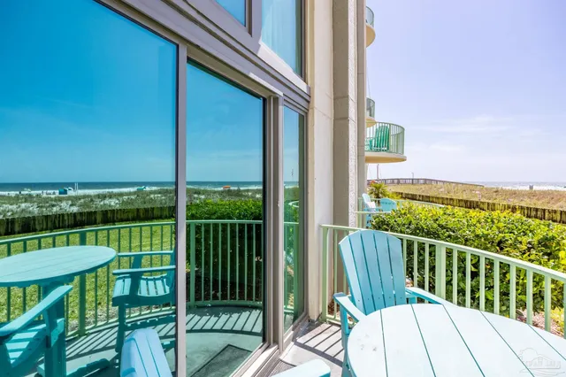 a view of a balcony with chairs