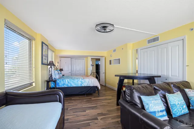 a very nice looking room with a wooden floor and white walls