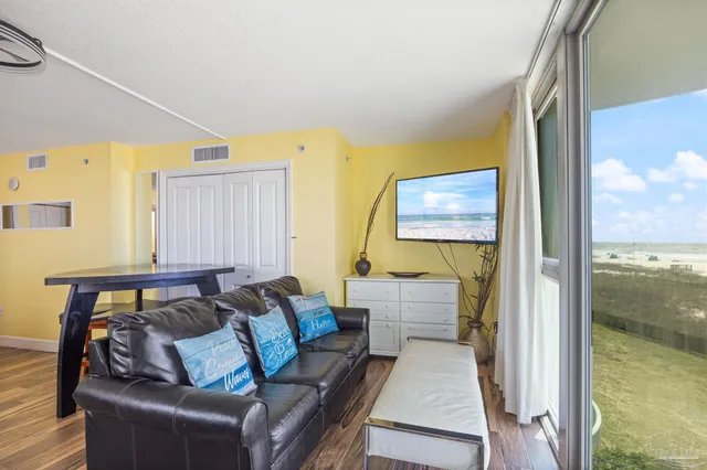 a view of a patio with iron fence