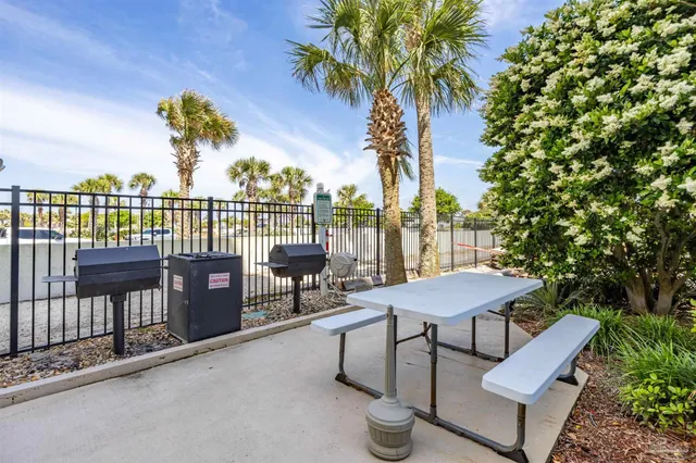 a view of swimming pool and brick wall