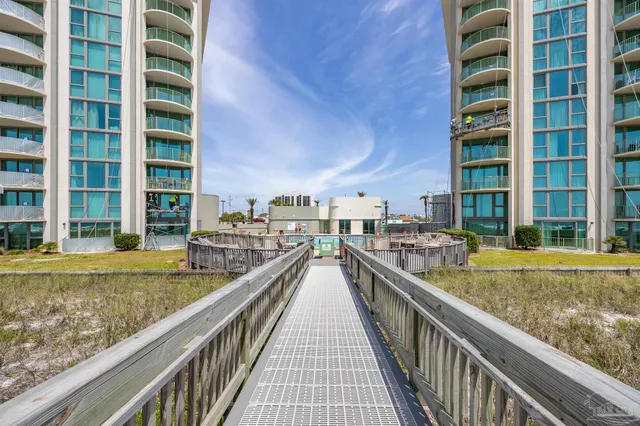 a front view of a house with a yard and fountain