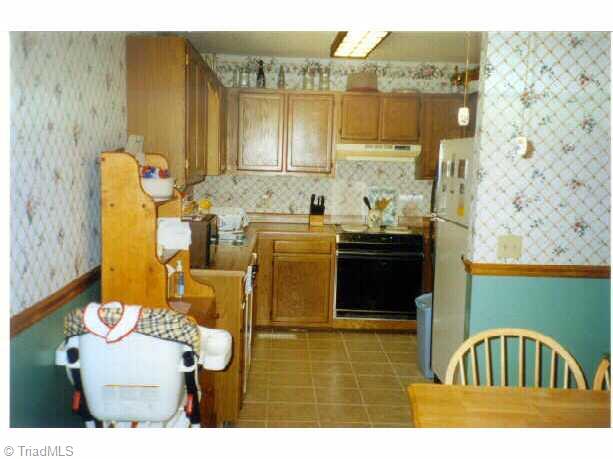 3609 Fieldview Road Pleasant Garden, NC 27313 - Photo 3 of 8 Other. With plenty of cabinets, range/oven & dishwasher, this country kitchen has a beautiful tile floor. There s a door to the outside from the breakfast area.