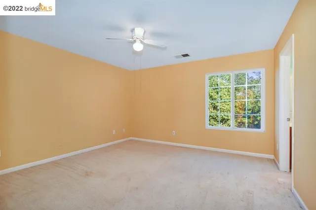 a spacious bathroom with a sink and a mirror
