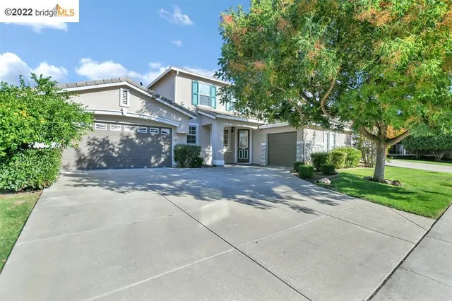 a view of a patio with a yard