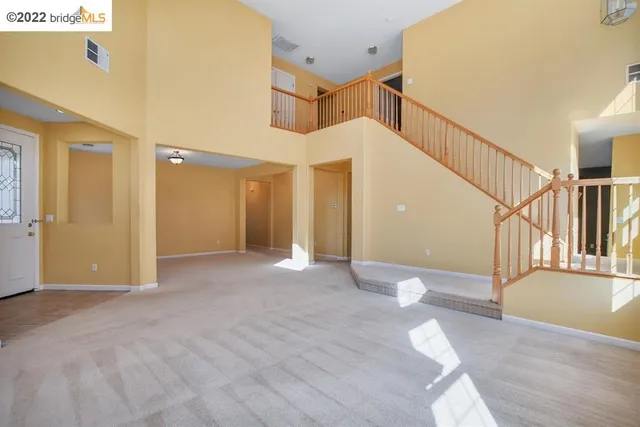 a view of a hallway with staircase