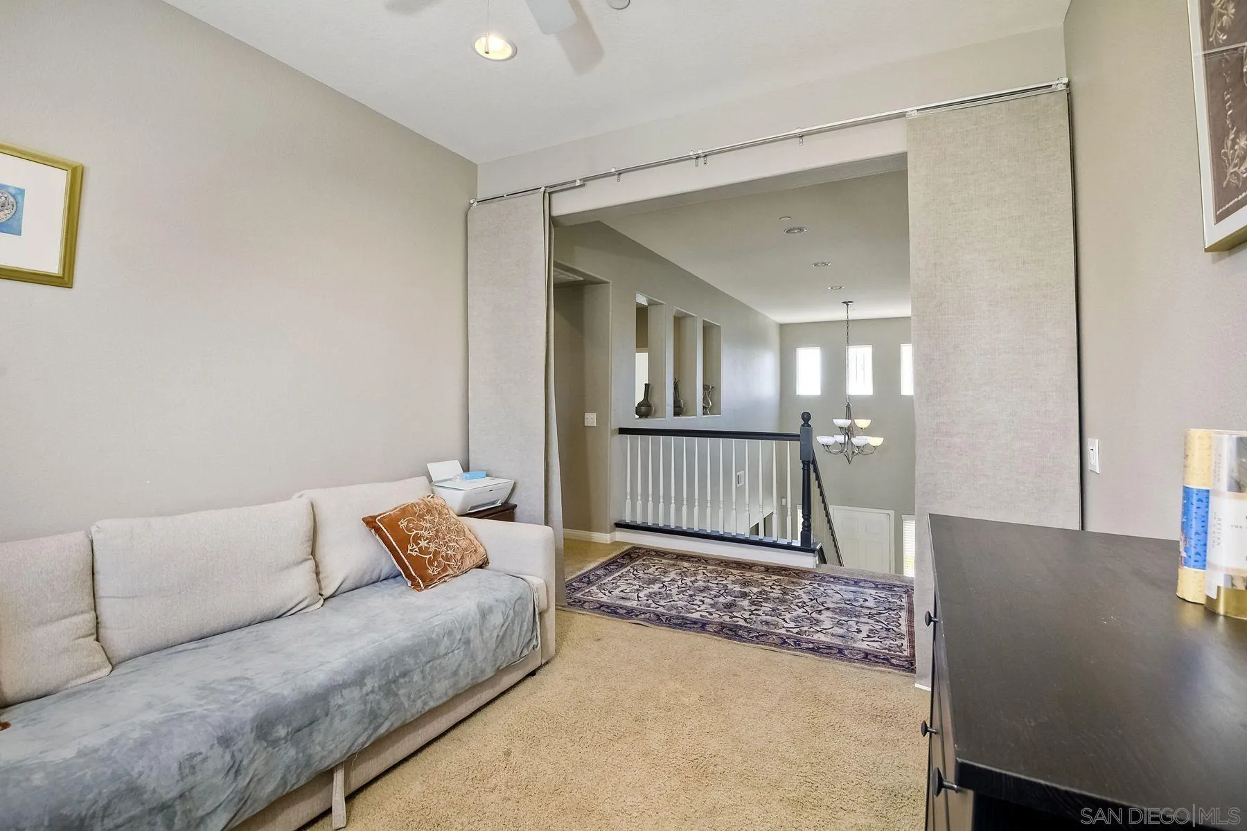 17161 Ralphs Ranch Road San Diego, CA 92127 - Photo 20 of 24 a living room with a couch and a table