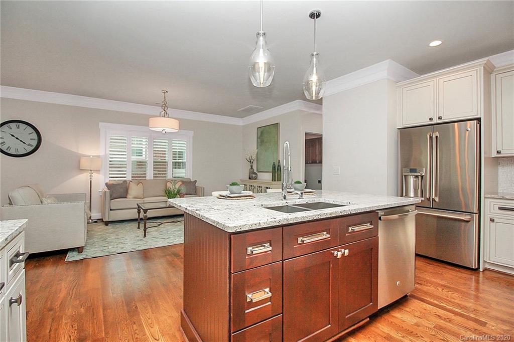 132 Scofield Road Charlotte, NC 28209 - Photo 15 of 44 a kitchen with kitchen island granite countertop a sink cabinets and stainless steel appliances