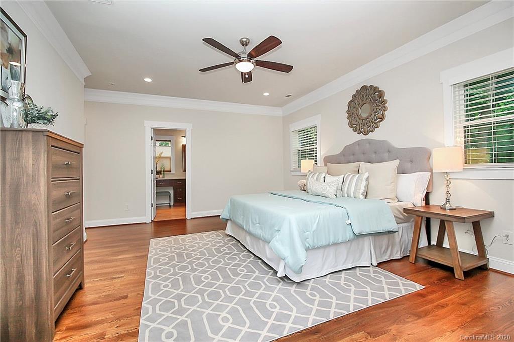 132 Scofield Road Charlotte, NC 28209 - Photo 19 of 44 a bedroom with a large bed and a window