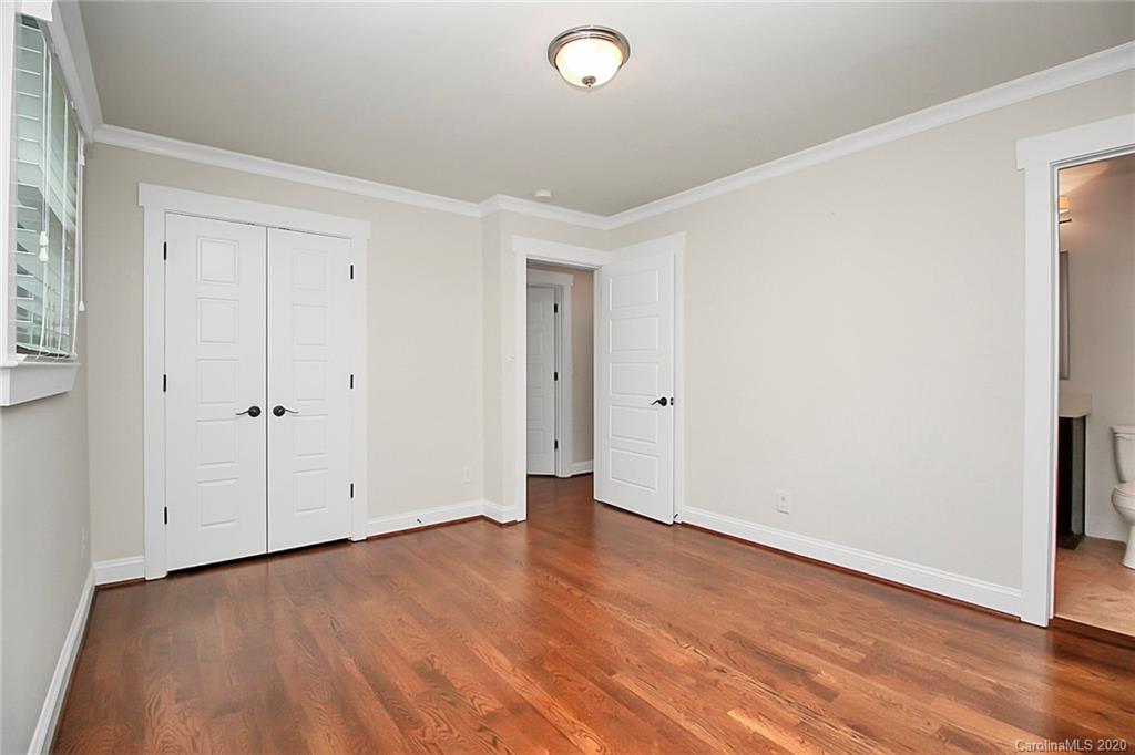 132 Scofield Road Charlotte, NC 28209 - Photo 24 of 44 a view of an empty room with wooden floor
