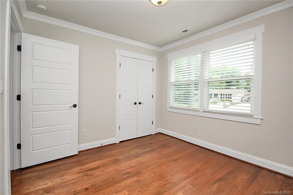 132 Scofield Road Charlotte, NC 28209 - Photo 29 of 44 a view of empty room with wooden floor and fan