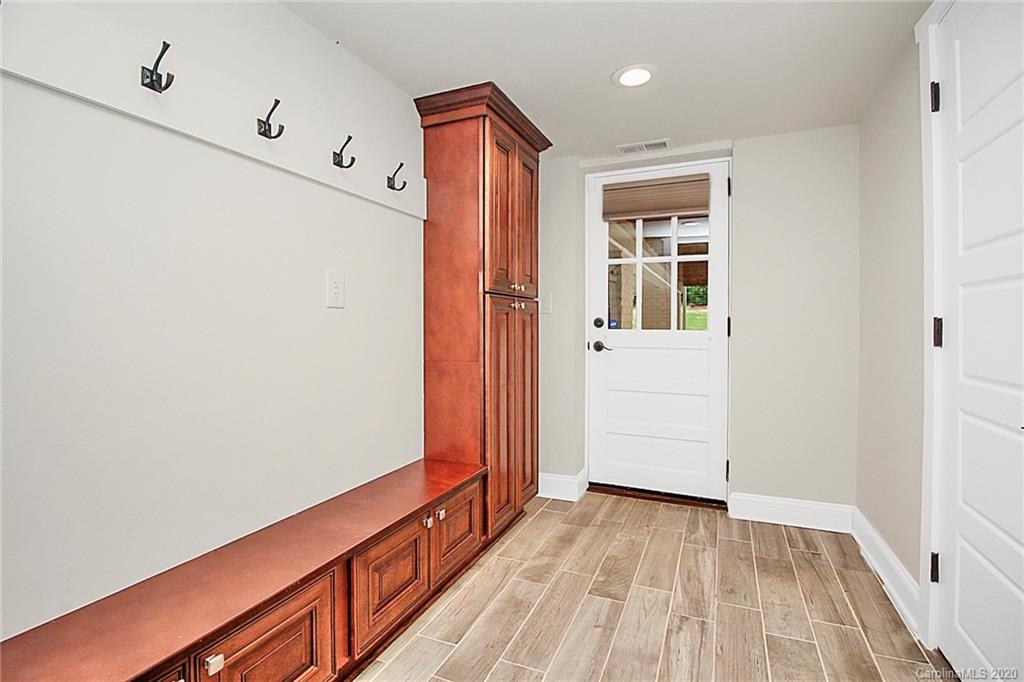 132 Scofield Road Charlotte, NC 28209 - Photo 33 of 44 a view of a hallway with wooden floor and entryway