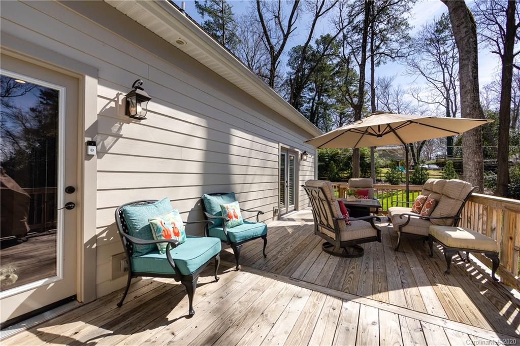 132 Scofield Road Charlotte, NC 28209 - Photo 34 of 44 a view of a patio with couple of chairs and a fire pit