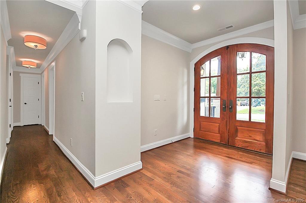 132 Scofield Road Charlotte, NC 28209 - Photo 5 of 44 an empty room with wooden floor and windows