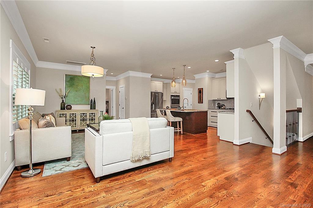 132 Scofield Road Charlotte, NC 28209 - Photo 8 of 44 a living room with furniture white walls and kitchen view