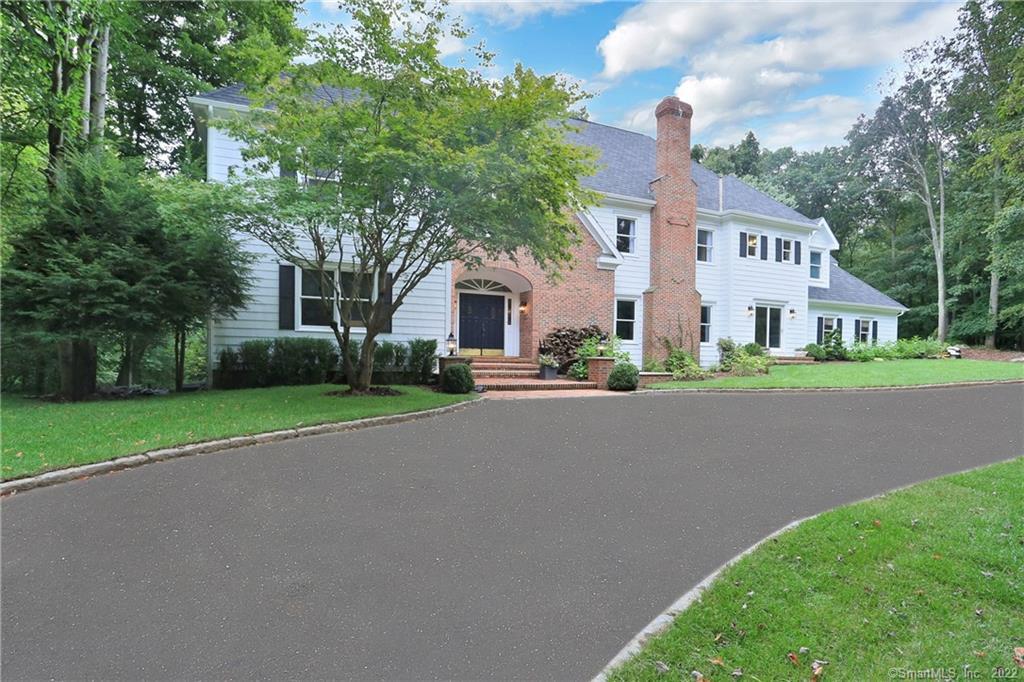 919 Catamount Road Fairfield, CT 06824 - Photo 1 of 1 a front view of house with yard and green space