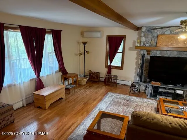 a living room with furniture and a flat screen tv