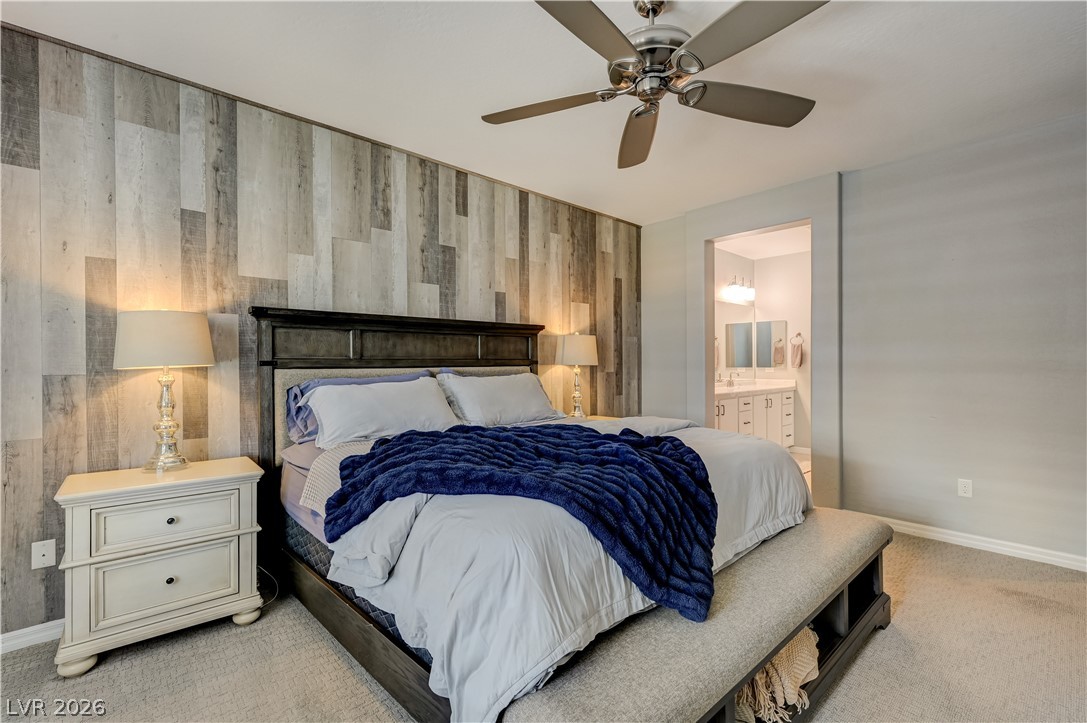 7049 Motley Road Las Vegas, NV 89178 - Photo 38 of 61 Planked wood detailing adds rich texture to this comfortable primary suite.