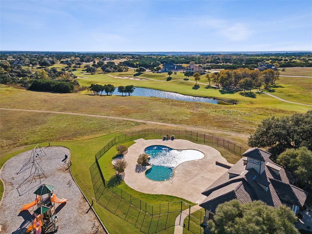 7301 Retreat Boulevard Cleburne, TX 76033 - Photo 28 of 40 an aerial view of a swimming pool with a mountain view