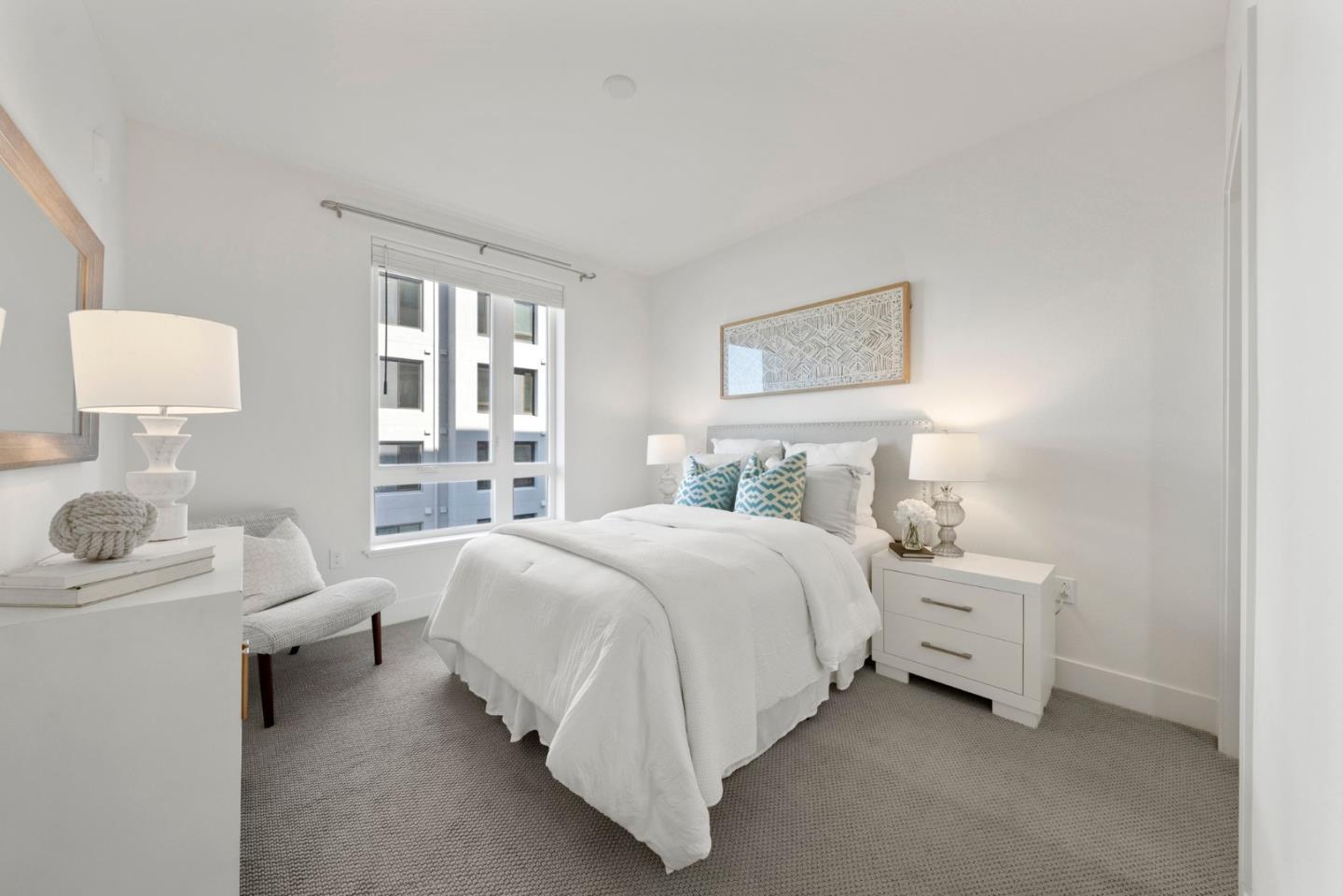 3578 Rambla Place, Unit 311 Santa Clara, CA 95051 - Photo 16 of 48 a spacious bedroom with a bed and a lamp