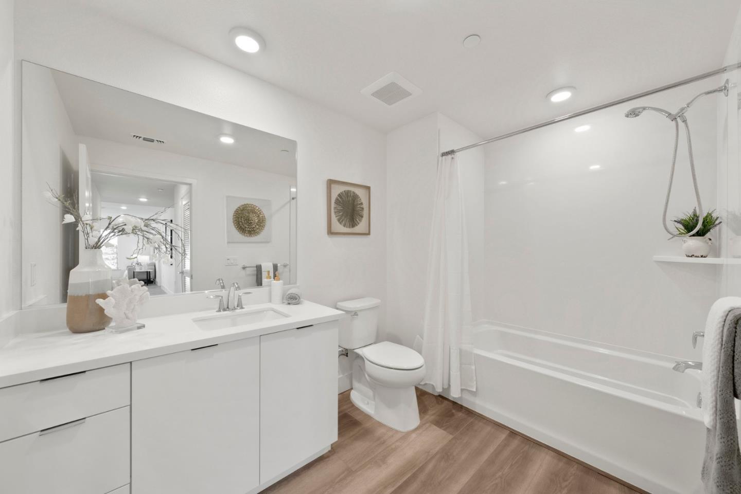 3578 Rambla Place, Unit 311 Santa Clara, CA 95051 - Photo 18 of 48 a bathroom with a double vanity sink toilet mirror and shower