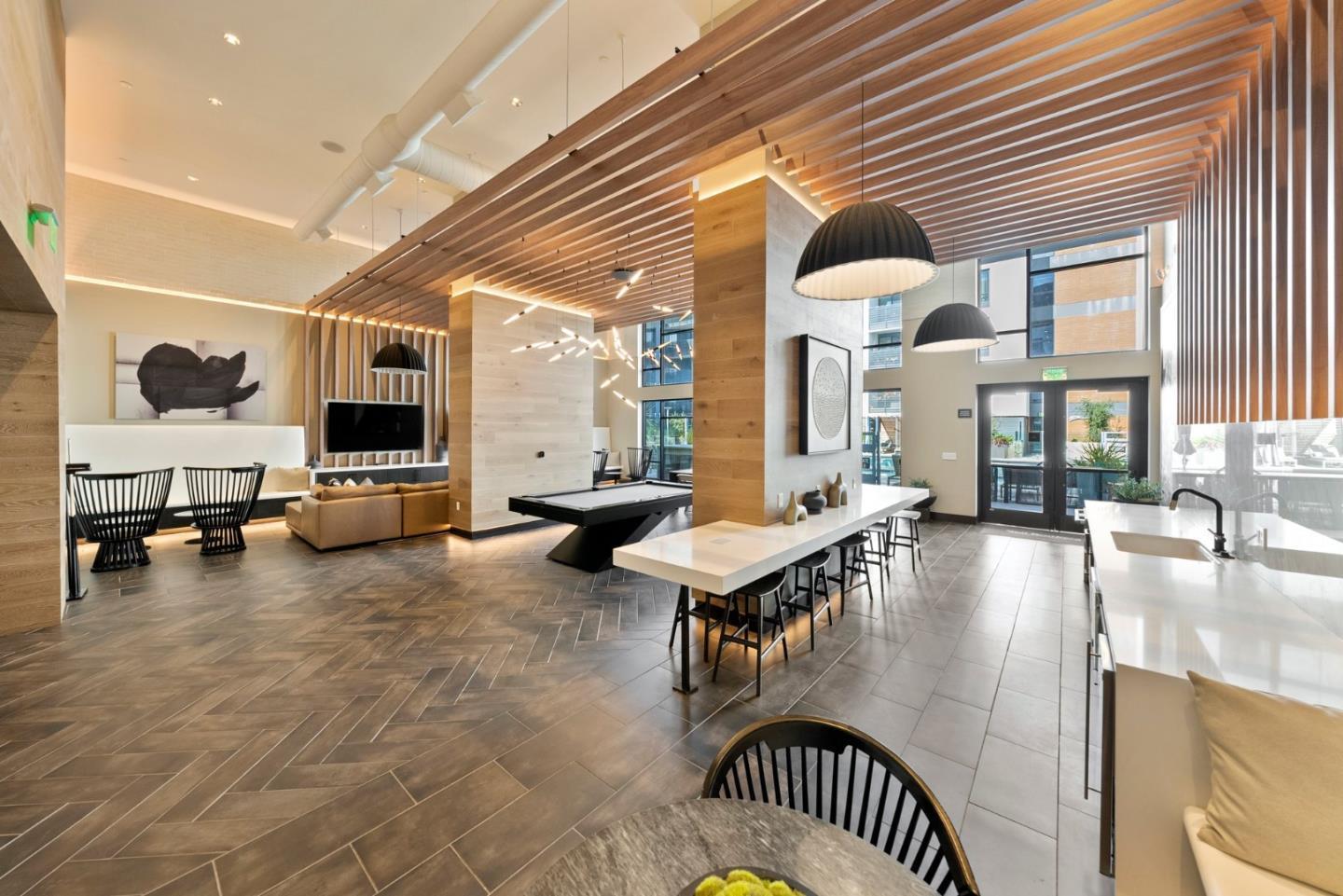3578 Rambla Place, Unit 311 Santa Clara, CA 95051 - Photo 23 of 48 a living room with furniture and a flat screen tv