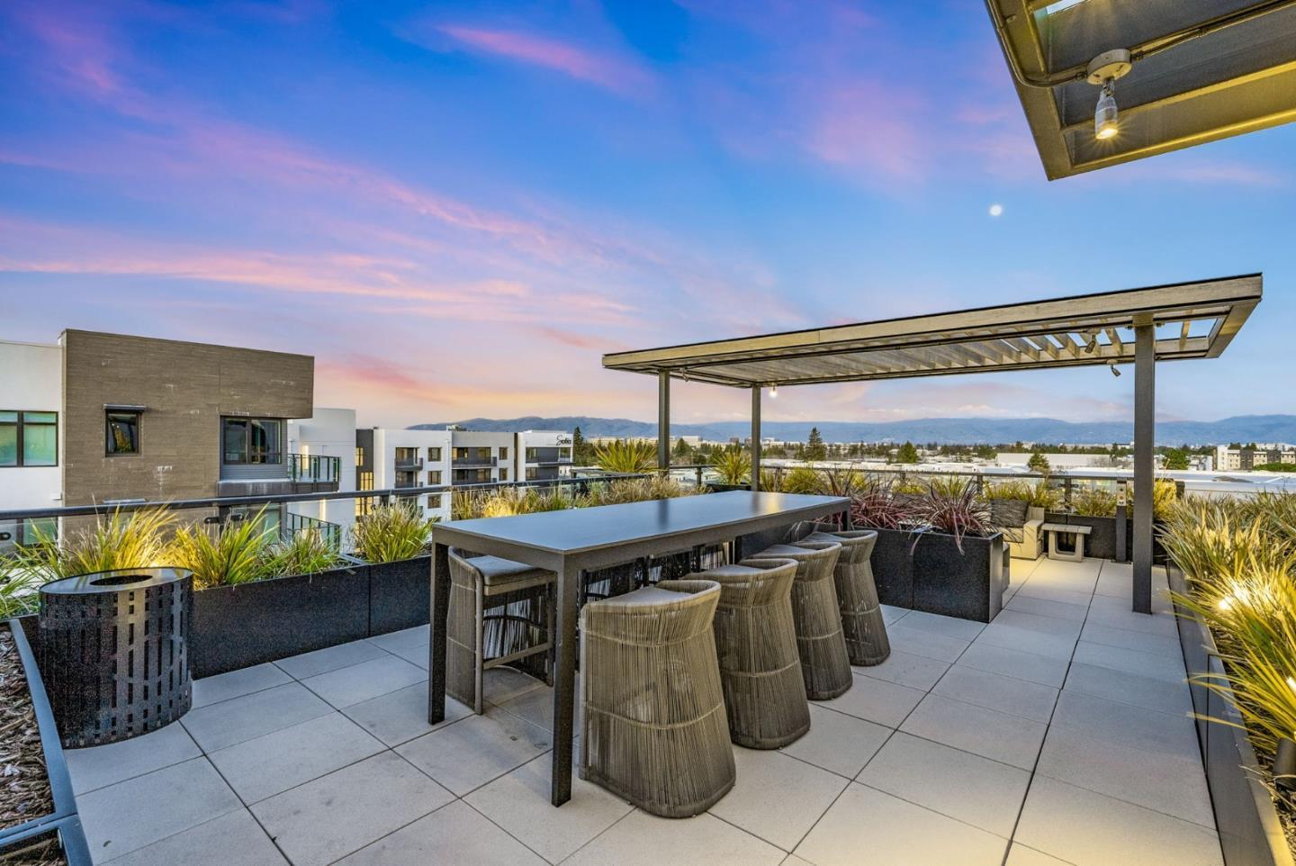 3578 Rambla Place, Unit 311 Santa Clara, CA 95051 - Photo 38 of 48 a view of a patio with a table and chairs