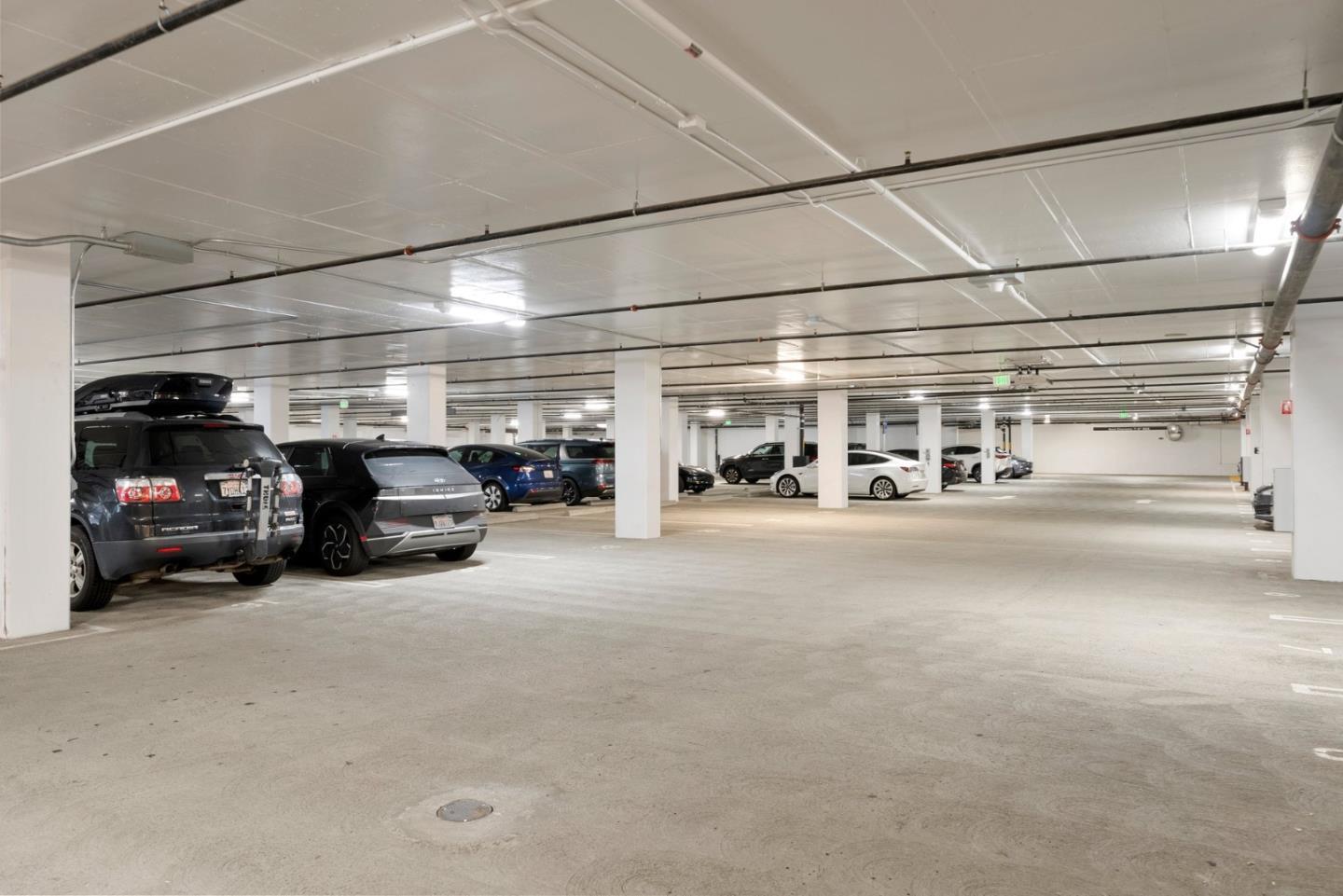 3578 Rambla Place, Unit 311 Santa Clara, CA 95051 - Photo 41 of 48 a car parked in a parking lot with cars