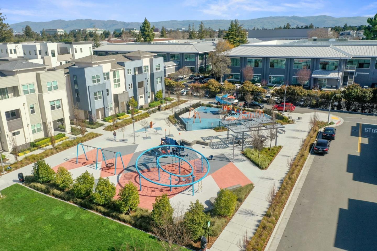 3578 Rambla Place, Unit 311 Santa Clara, CA 95051 - Photo 42 of 48 an aerial view of a swimming pool with outdoor seating and a mountain view