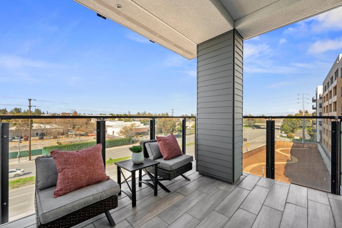 3578 Rambla Place, Unit 311 Santa Clara, CA 95051 - Photo 10 of 48 a outdoor sitting area with furniture and wooden floor